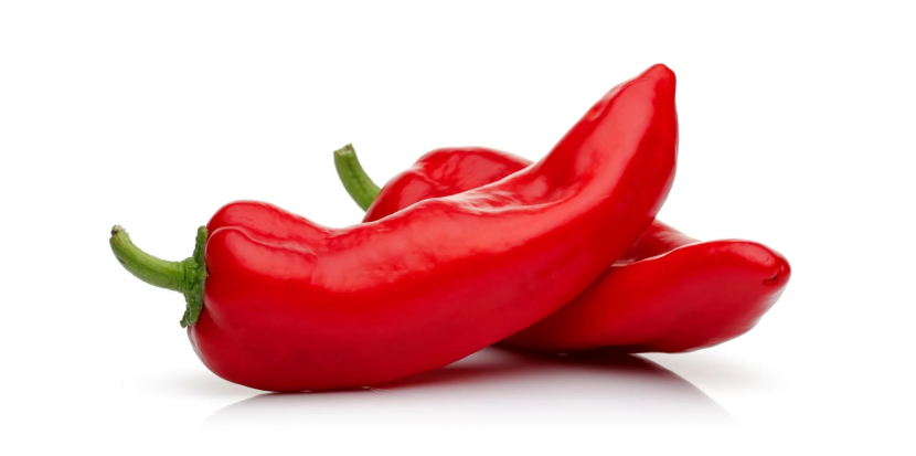 Close-up of Naga chillies showing their intense red color, illustrating how hot a Naga chilli is on the Scoville scale.